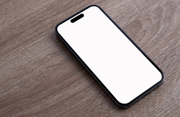 istock Mobile phone on the wooden floor. 1664423870