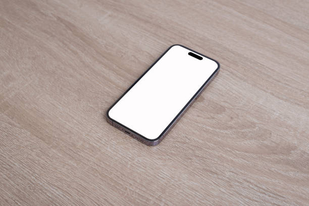 istock Mobile phone on the wooden floor. 1664423871