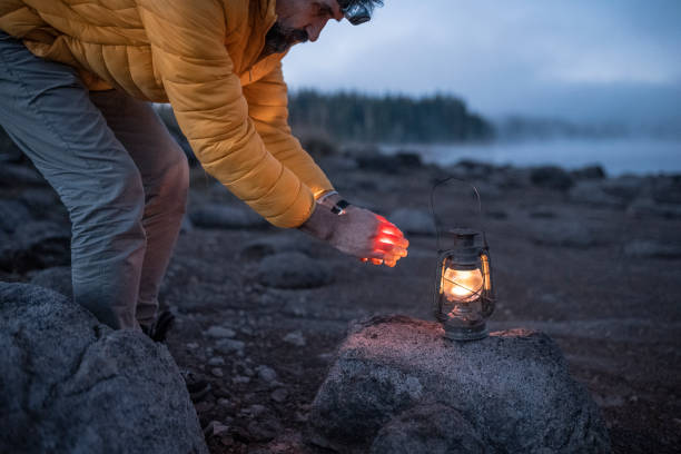 istock People and nature. Man camping at lakeshore. copy space. 1664429936