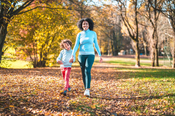 istock Loving Multi-Ethnic Mother And Son Enjoying Autumn Days 1664439486