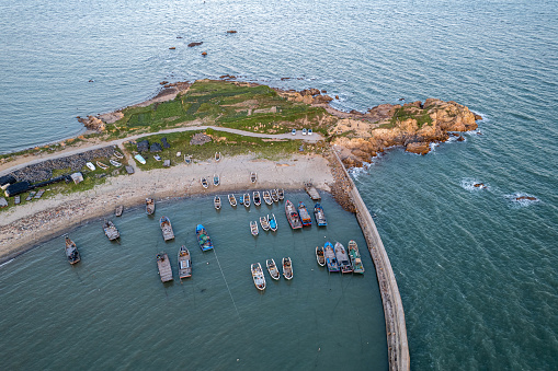 Aerial view of fishing boats docked in the ocean and fishing ports