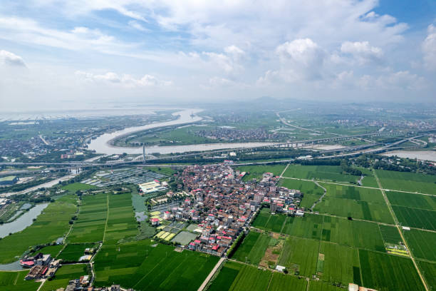 Aerial view of the green plain around which the river flows