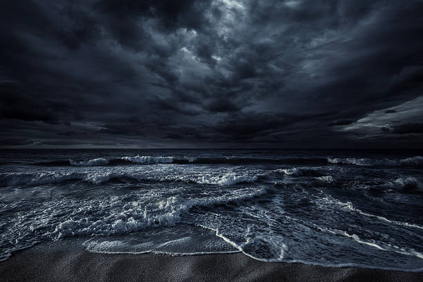 Stormy sea Shot of stormy sea and rocks against. stormy sea shore stock pictures, royalty-free photos & images