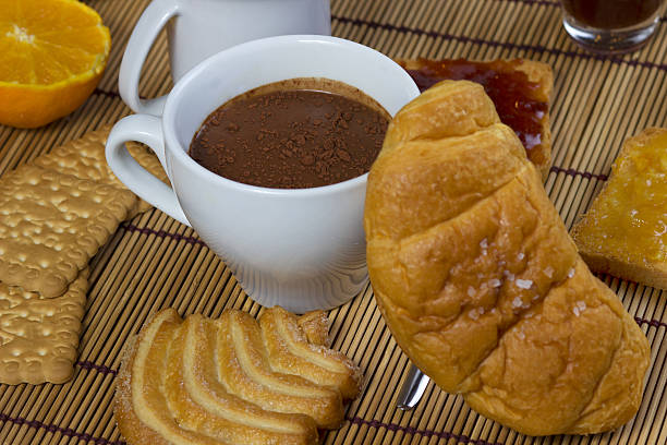 istock Nice cup of coffee with cocoa and croissant 166447562
