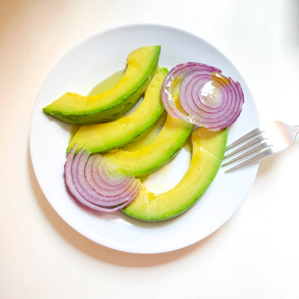 Avocado slices with red Spanish onion