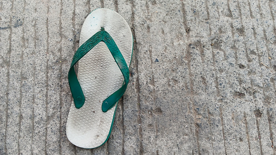 Background of a flip flop on the road