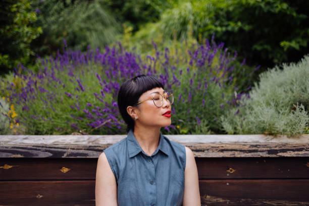 istock A Happy Beautiful Asian Keeping Her Eyes Closed While Enjoying Spending Her Leisure Time Outdoors 1664543886