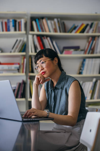 istock A Frustrated Beautiful Asian Businesswoman With Glasses Using Her Computer While Working In The Office 1664544454