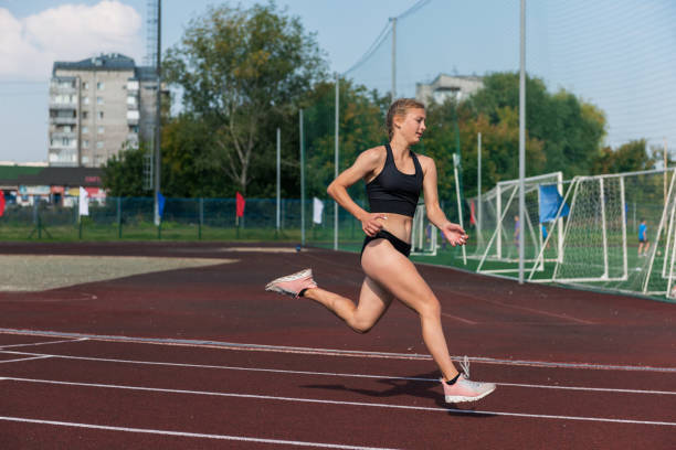 istock Young girl running on the running track 1664546705