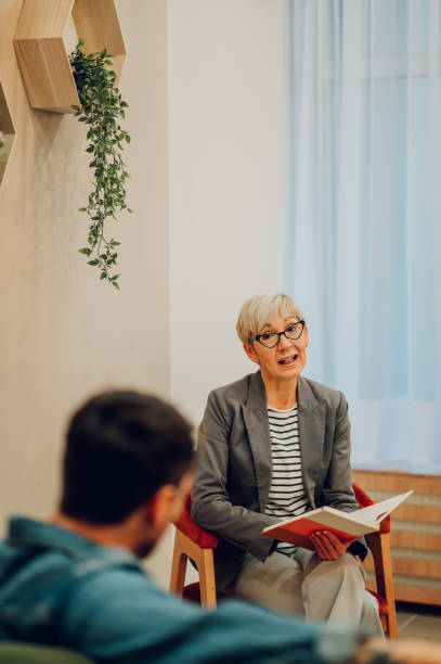 istock A professional psychotherapist advising and having a serious conversation with a patient during the session in the office. 1664549485