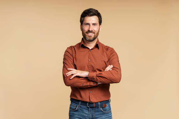 istock Handsome smiling middle aged businessman, manager posing arms crossed isolated 1664568690