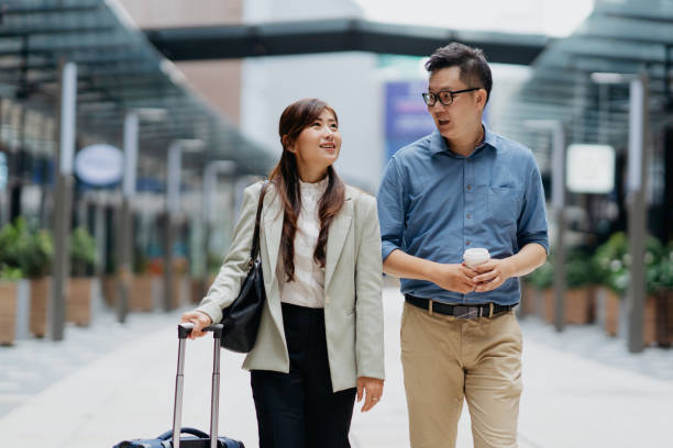 istock Two business people on a business trip 1664574499