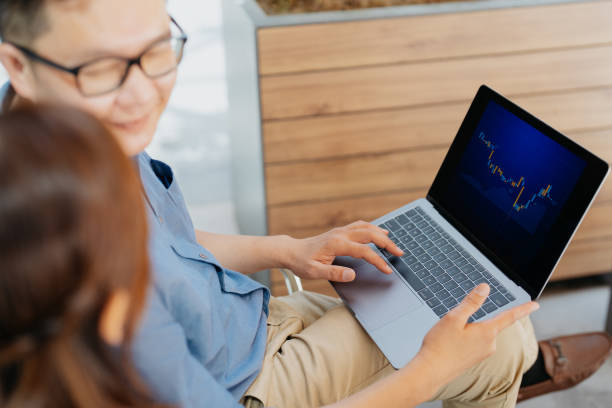 istock Asian business team working on laptop in a cafe 1664575018