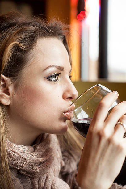 istock Young Woman with Beautiful Blue Eyes Drinking Red Wine 166464008