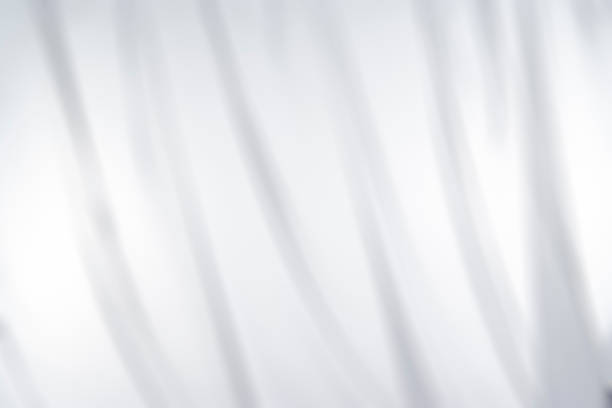 istock Defocused white lace curtain texture background 1664654272