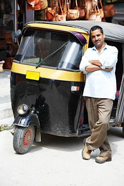 Indian auto rickshaw three-weeler tuk-tuk taxi driver man