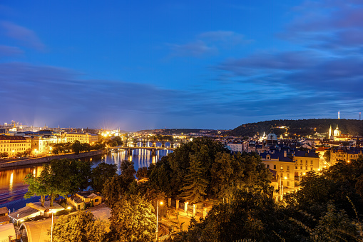 View over Prague at night with the Mala Strana district at the right