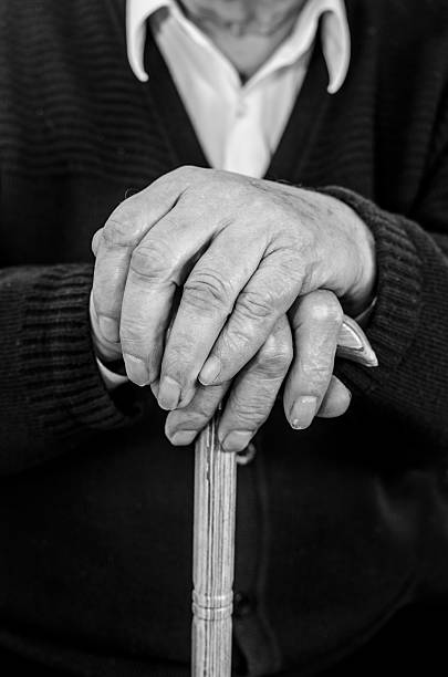 istock Hands of a senior man holding cane 166473735