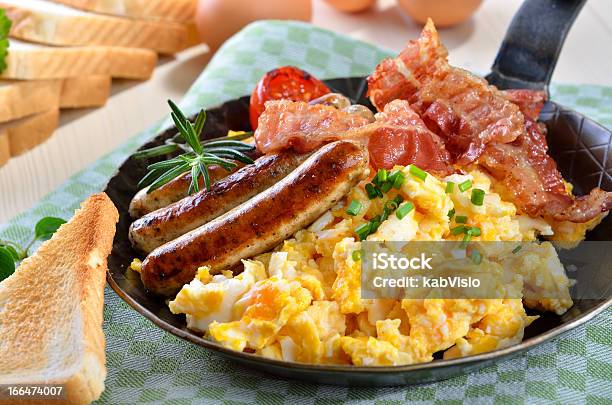 Scrambled Eggs And Sausages Stock Photo - Download Image Now - Breakfast, Bacon, Sausage