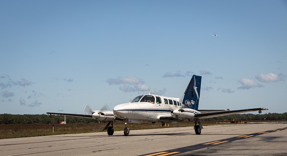 West Tisbury, United States – September 01, 2023: A Cape Airways airplane taxiing on the runway at Martha's Vineyard Airport in West Tisbury