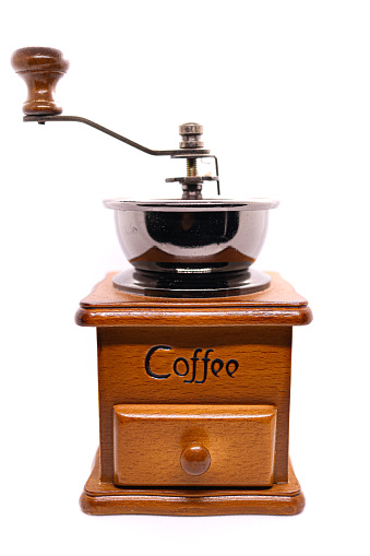 Vintage coffee grinder isolated on a white background. Single object. Creative layout. Flat lay, top view. Nostalgia old things. Design element
