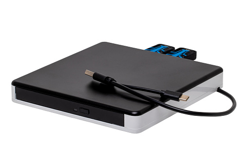 External DVD CD usb burner drive and player with integrated USB interfaces (two connected), SD TF and micro connections. Clipping path. Computer accessories.