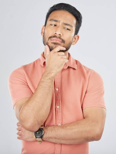 istock Confused, thinking and asian man in studio for planning, decision or questions on grey background space. Idea, why and Japanese male model with choice, brainstorming or problem solving doubt emoji 1664876949