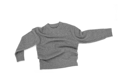 Close-up, top view of a men's gray recycled-rich sweater, against a white background