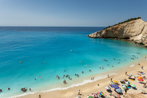 Porto Katsiki beach in Lefkada island, Greece. Beautiful view over the beach with  turquoise water and  tourists