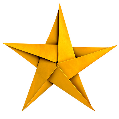 Gold Paper Star as a symbol of Winning as an origami Sculpture for success symbol as a golden winning first place award object isolated on a white background.