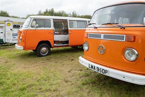 View of orange Volkswagen Type 2 Kombi van At a Staffordshire vintage car show