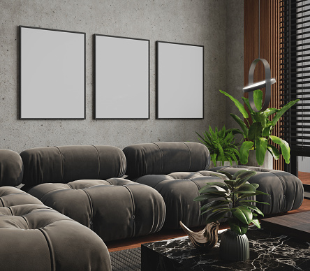 Blank picture frame mockup in living room with table lamp plant and concrete wall.3d rendering