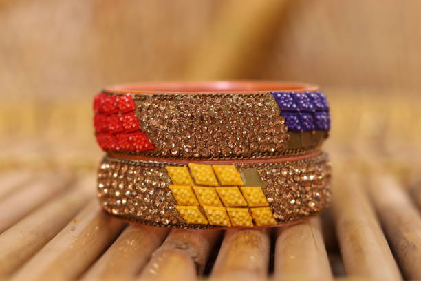 istock Rajasthani Style pair of Colourfull bangles or Kada on the bamboo table piles on each other straight 1664949944