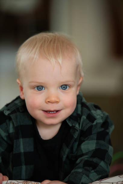 First Steps Young Toddler learning to Walk stock photo