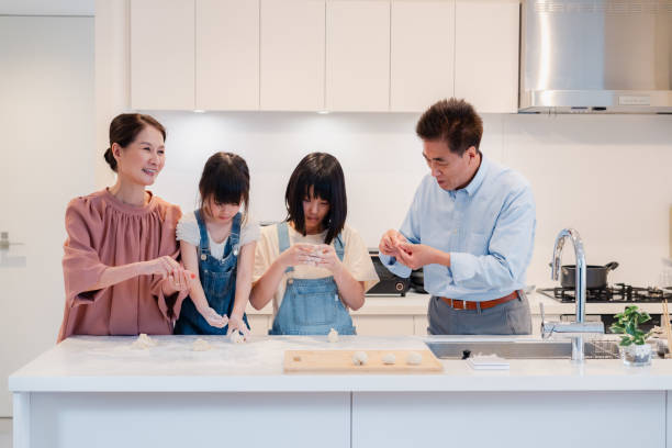 istock Children cooking with their grandparents 1665002532