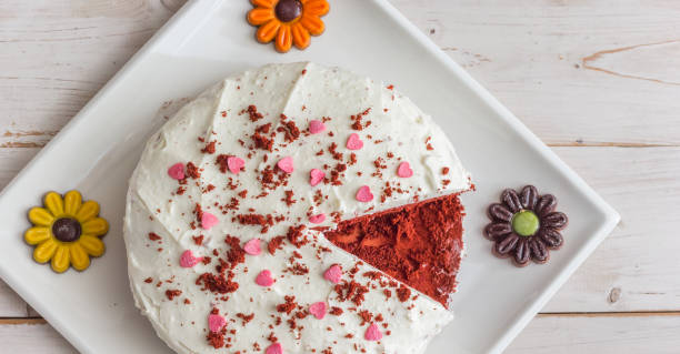 istock Panoramic view of a red velvet cake on a white wooden table 1665046155