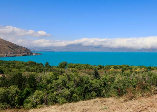 istock Scenic view of the lake Sevan with the hills hidden in the clouds 1665055809