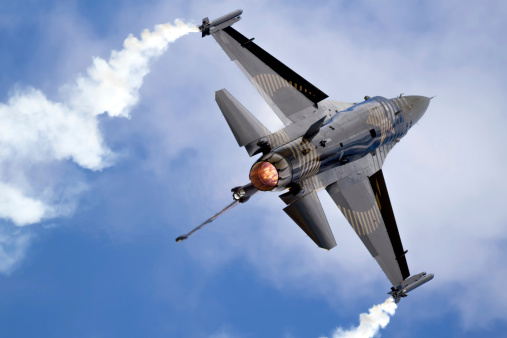 Lockheed Martin F-16 Fighting Falcon performing with afterburner and Smoke-winders.