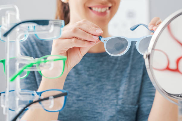 istock Happy woman at the eyewear store 1665075509