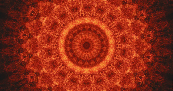Kaleidoscope background. Fire mandala. Shiny glitter red orange color glowing round symmetrical abstract decorative ornament with sparks.