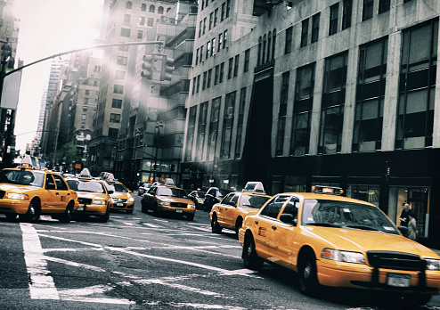 Rush Hour Yellow Cabs Midtown Manhattan NYC. Toned Image.
