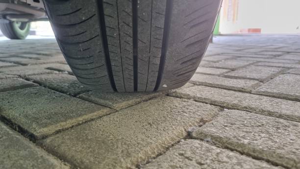 istock Close up of a car tire on a paved floor. 1665086607