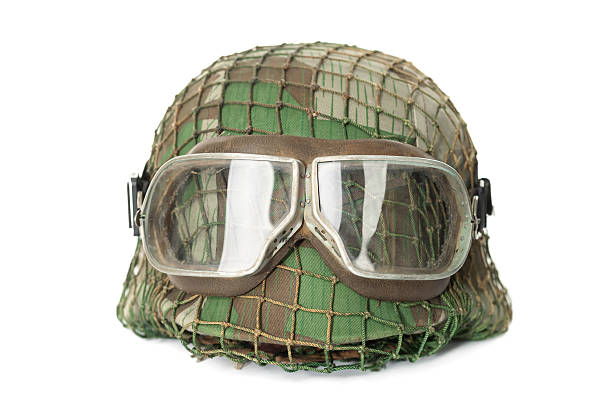 camouflaged helmet with protective goggles stock photo
