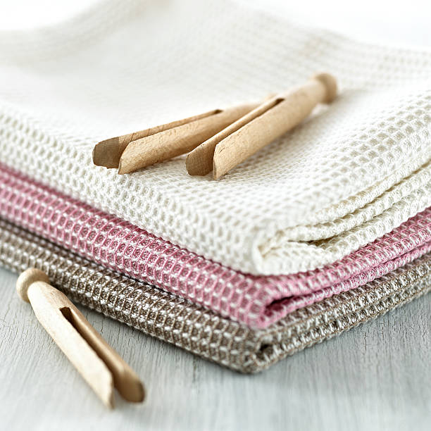 Clothespins on a tea towel stock photo