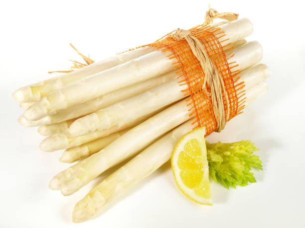 istock White Asparagus with a Spring Flower - Isolated 1665125651