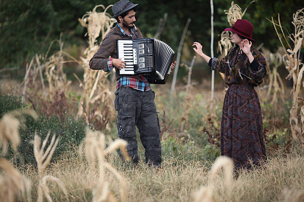 istock girl dancing and man playing accordion 166512862