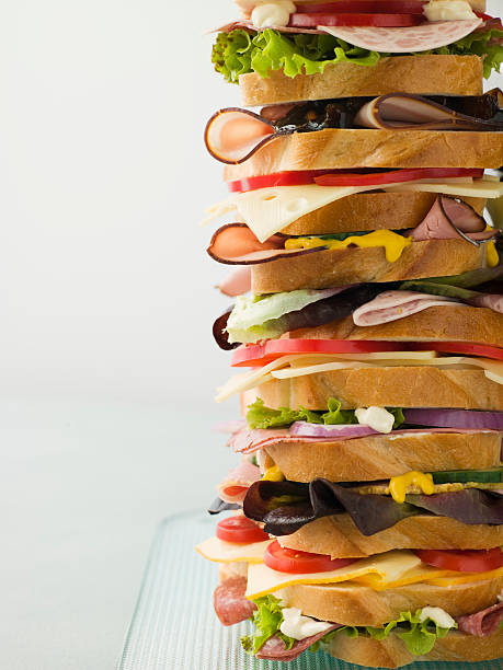 Dagwood Tower Sandwich Dagwood Tower Sandwich On Glass Plate dagwood stock pictures, royalty-free photos & images