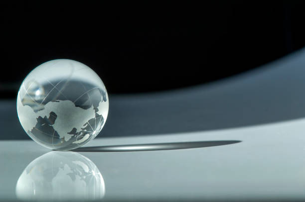 istock Crystal ball with world map on it 1665134275