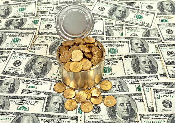 istock Russian  coins in the can over US banknotes background 166513541