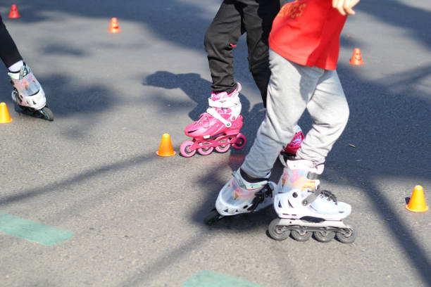 istock group of kids playing roller skates in park streets 1665147821